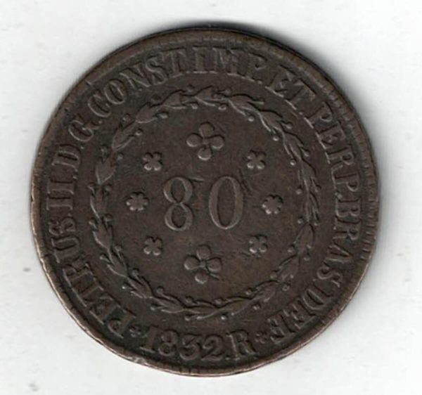 1832 R Brazil Copper Eighty Reis Coin. The obverse features the denomination within wreath. The reverse features a wreath and crowned arms.