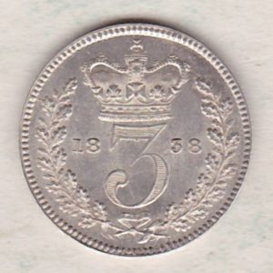 1838 Silver Maundy Threepence coin featuring Queen Victoria on the obverse. The reverse features a crowned denomination dividing date within an oak wreath. 
