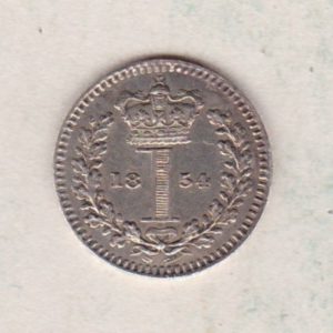 1854 Silver Maundy Penny coin featuring Queen Victoria on the obverse. A central crowned denomination above the date on the reverse.