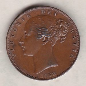 1858 copper farthing coin featuring the young head Queen Victoria on the Obverse. Britannia seated facing right on the Reverse.