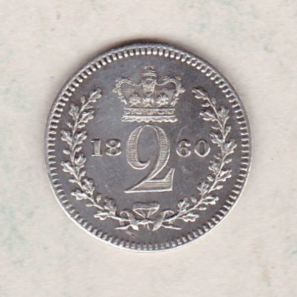 1860 Silver Maundy Twopence coin featuring Queen Victoria on the obverse. A crowned denomination dividing the date on the reverse.