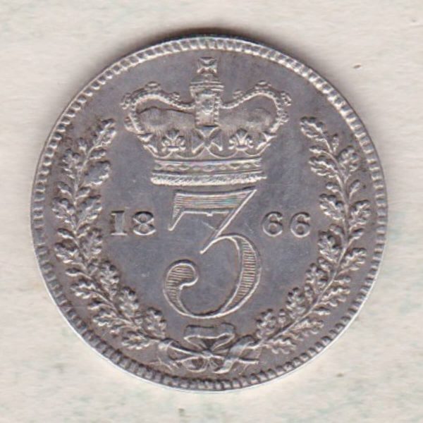 1866 Silver Maundy Threepence coin featuring Queen Victoria on the obverse. The reverse features a crowned denomination dividing date within an oak wreath. 