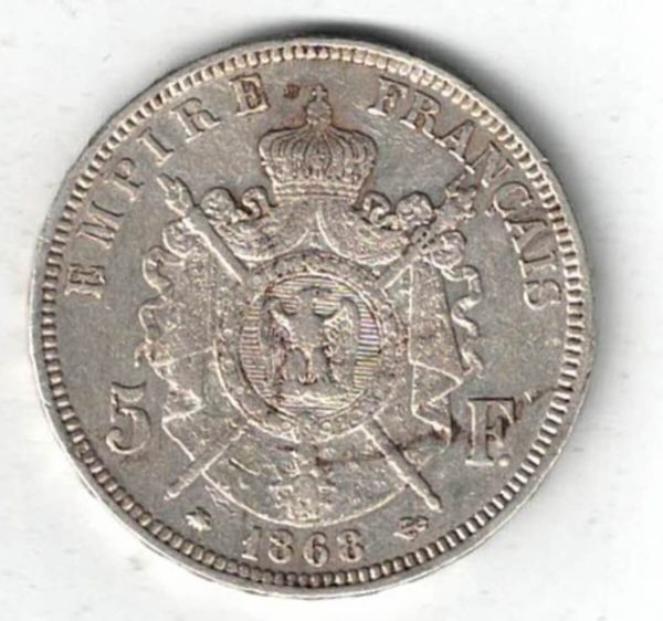 1868 A France Silver Five Francs coin featuring Napoleon III on the Obverse. A wreath of laurels, date and mint mark on the Reverse.
