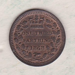 1868 Bronze Third Farthing the portrait of Queen Victoria on the obverse. The reverse shows the crowned value and date within an laurel wreath.