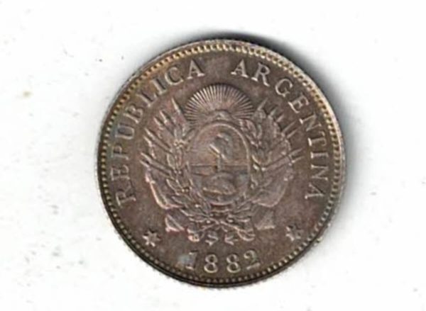 1882 Argentina Silver Twenty Centavos Coin. The obverse features the arms of Argentina with date below. The reverse features a freedom head.