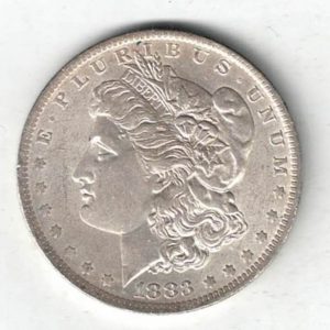 1883 O Silver USA Morgan Dollar coin featuring lady liberty on the obverse. The eagle holding arrows and an olive branch on the reverse.