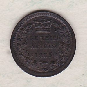 1885 Bronze Third Farthing the portrait of Queen Victoria on the obverse. The reverse shows the crowned value and date within an laurel wreath.