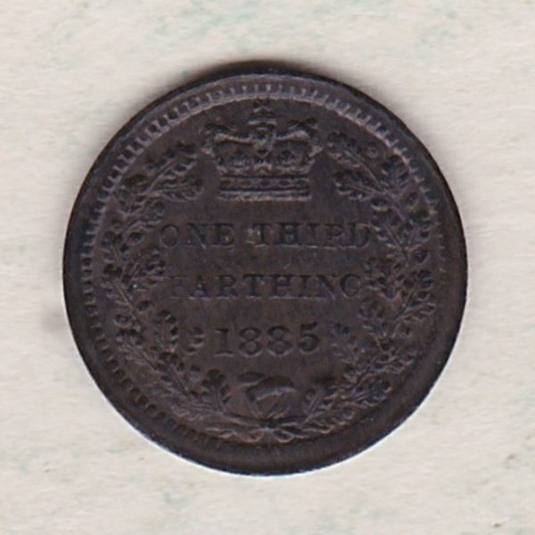 1885 Bronze Third Farthing the portrait of Queen Victoria on the obverse. The reverse shows the crowned value and date within an laurel wreath.