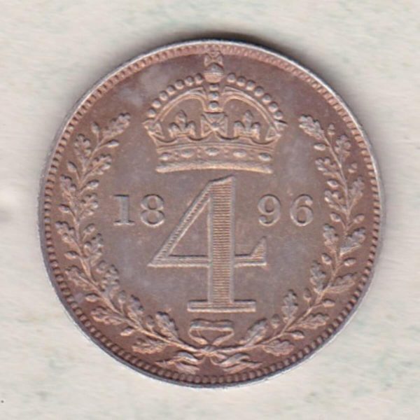 1896 silver maundy fourpence coin featuring Queen Victoria on the Obverse. The crowned denomination dividing date within an oak wreath on the Reverse.