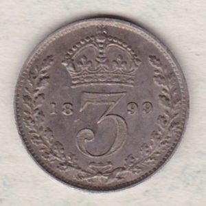 1899 Silver Maundy Threepence coin featuring Queen Victoria on the obverse. The reverse features a crowned denomination dividing date within an oak wreath. 