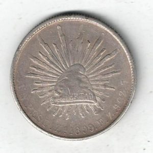 1899 Zs FZ Mexico Silver One Peso Coin. The obverse features the national arms of mexico with eagle & snake. All coins are in stock.