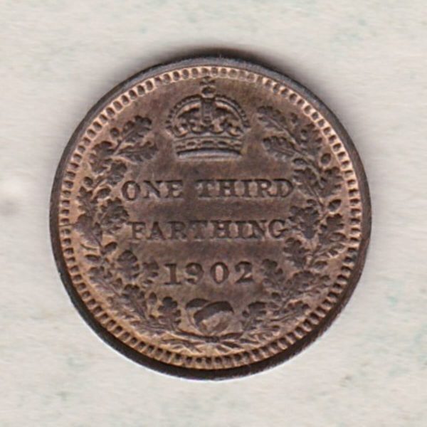 1902 Bronze Third Farthing the portrait of King Edward VII on the obverse. The reverse shows the crowned value and date within an laurel wreath.