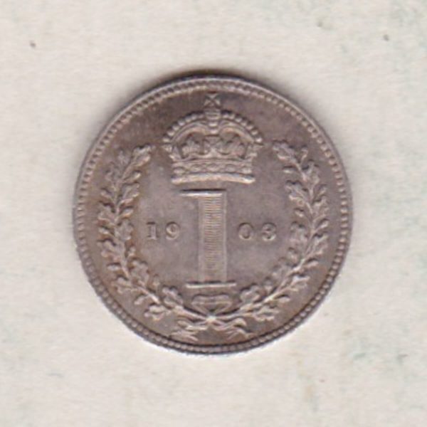 1903 Silver Maundy Penny coin featuring King Edward VII on the obverse. A crowned denomination dividing date within an oak wreath. on the reverse.