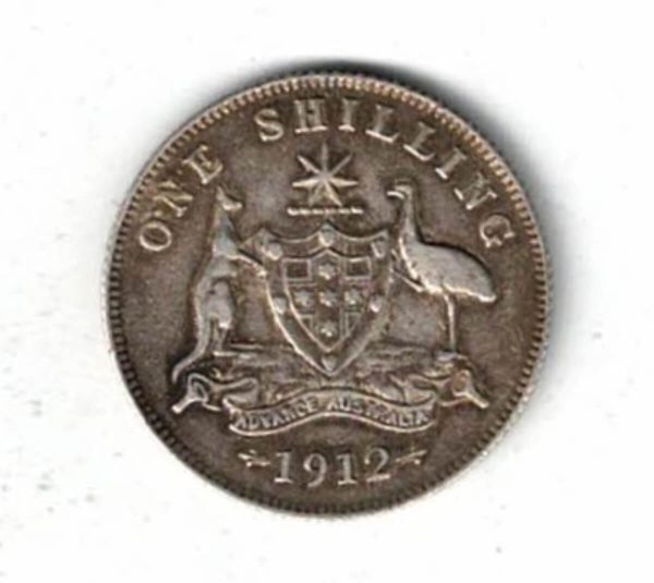 1912 Australia Silver One Shilling. The obverse features the bust of George V facing left. the reverse features the Australia coat of arms.