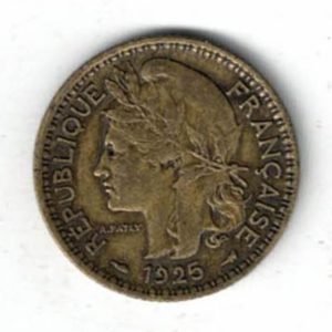 1925 Cameroon One Franc Coin. The obverse features Marianne on facing left with date below. The reverse three palm tree leaves with ribbon. 