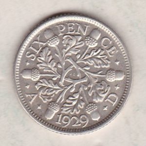 1929 Silver Sixpence coin featuring King George V on the Obverse. The Reverse features three oak sprigs with date and denomination.