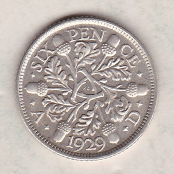 1929 Silver Sixpence coin featuring King George V on the Obverse. The Reverse features three oak sprigs with date and denomination.
