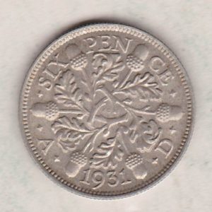 1931 Silver Sixpence coin featuring King George V on the Obverse. The Reverse features three oak sprigs with date and denomination.