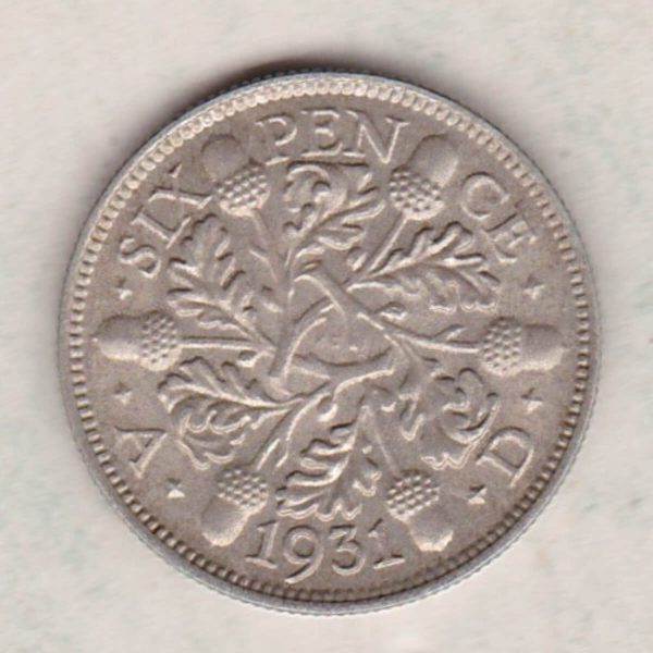 1931 Silver Sixpence coin featuring King George V on the Obverse. The Reverse features three oak sprigs with date and denomination.