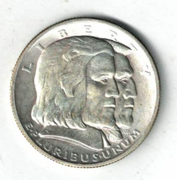 1936 USA Long Island Silver Half Dollar Coin. The obverse features a Dutch settler and a native American facing right. The reverse features a Dutch ship.