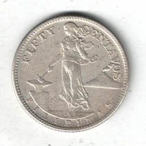 1944 S Philippines Silver Fifty Centavos Coin. The obverse features a standing lady holding a hammer with volcano on the right.