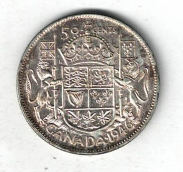 1946 Canada Silver Fifty Cent Coin. The obverse side of the coin features George VI facing left. The reverse features the Royal Coat of Arms of Canada.