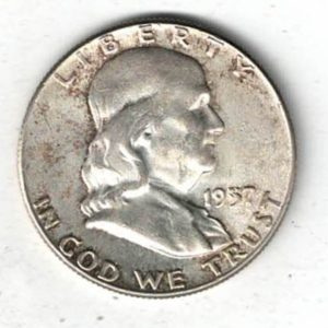 1957 USA Franklin Silver Half Dollar Coin. The obverse features Benjamin Franklin facing right. The reverse features a Liberty bell.