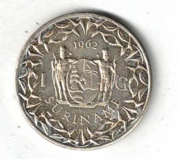 1962 Suriname Silver One Gulden Coin. The obverse features the portrait of Juliana facing right. The reverse features the value with the coat of arms.