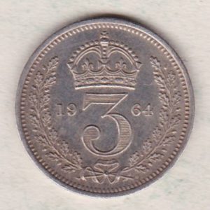 1964 Silver Maundy Threepence coin featuring Elizabeth II on the obverse. The reverse features a crowned denomination dividing date within an oak wreath. 
