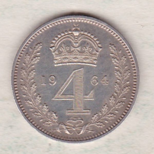 1964 silver maundy fourpence coin featuring Queen Elizabeth II on the Obverse. The crowned denomination dividing date within an oak wreath on the Reverse.