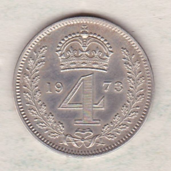 1973 silver maundy fourpence coin featuring Queen Elizabeth II on the Obverse. The crowned denomination dividing date within an oak wreath on the Reverse.