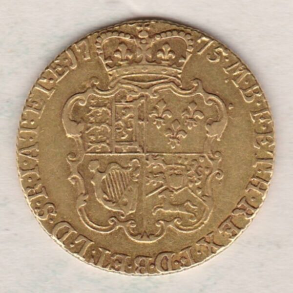 1775 Gold Guinea Coin featuring the fourth laureate head portrait of King George III on the obverse. The crowned quartered shield on the reverse.