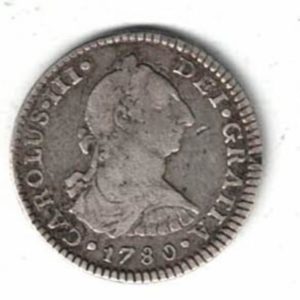 1780 FF Mexico Silver One Real Coin. The obverse features the bust facing right. The reverse features Hispanic arms a pair of pillars.