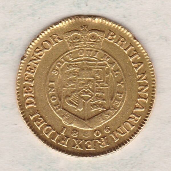 1806 Gold Half Guinea Coin featuring the laureate head portrait of King George III on the obverse. The reverse features the crowned shield of arms.