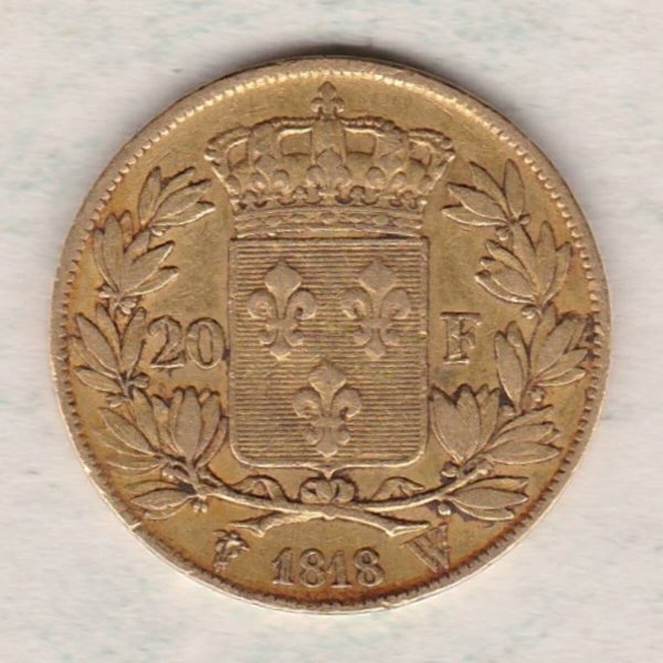 1818 W France Gold Twenty Francs coin featuring the portrait of Louis XVIII on the Obverse. The crowned shield of France on the Reverse.