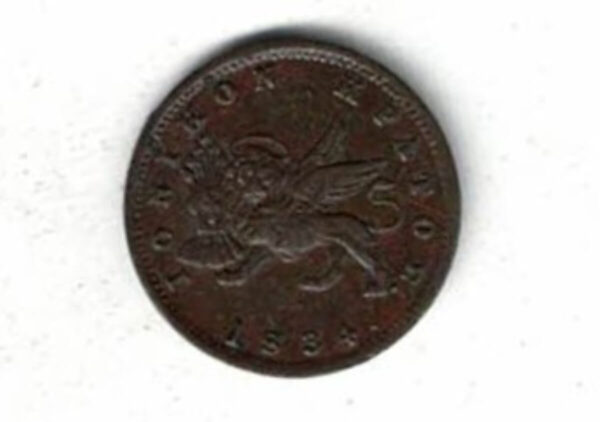 1834 Ionian Islands Copper One Lepton Coin. The obverse features a winged lion of St. Mark. The reverse features seated Britannia. 