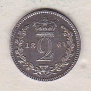 1861 Silver Maundy Twopence coin featuring Queen Victoria on the obverse. A crowned denomination dividing the date on the reverse.
