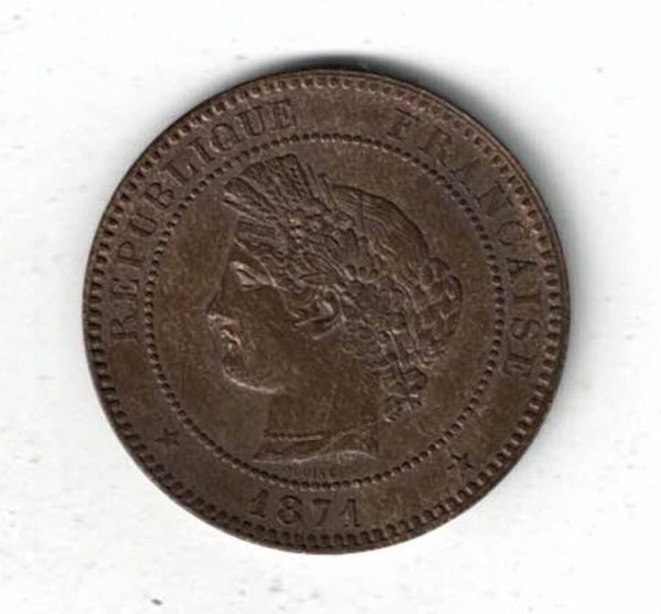 1871 A France Bronze Ten Centimes Coin. The obverse features the head of the Republic on the left as Ceres. The reverse features a wreath with value.