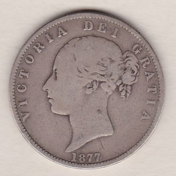 1877 Silver Halfcrown coin with young head Queen Victoria on the Obverse. Crowned square shield with laurel branches on the Reverse.