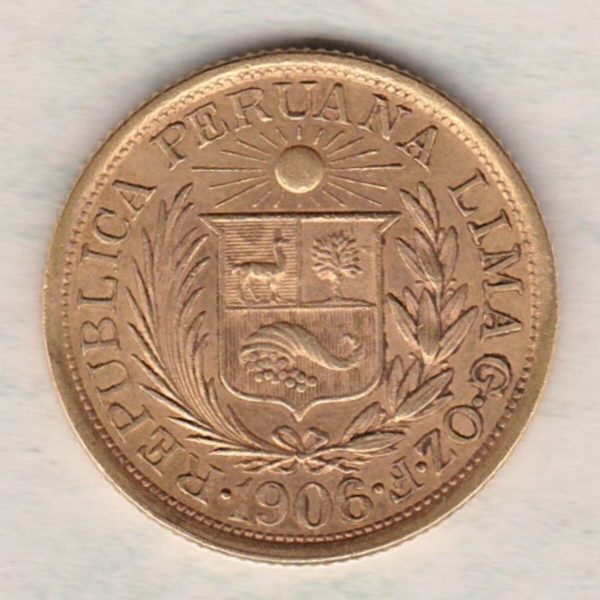 1906 Peru Gold Libra coin. The obverse features a wreath around a radiant sun above a shield. The reverse features the right facing portrait. 