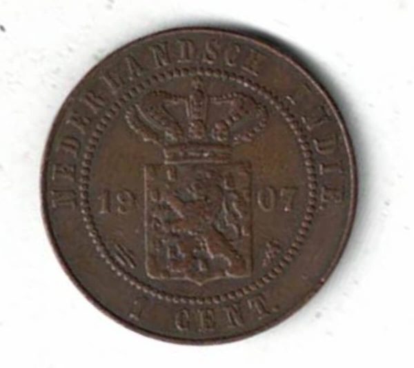 1907 Netherlands East Indies Copper One Cent Coin. The obverse of this coin features the a lion on shield with crown above.
