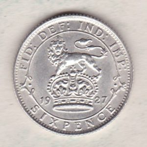 1927 Silver Sixpence Modified Effigy coin featuring King George V on the Obverse. The Reverse features a crowned lion with date and denomination.