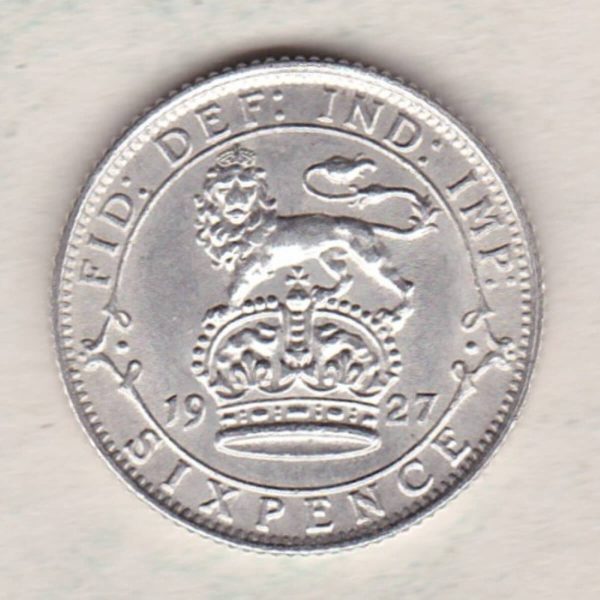 1927 Silver Sixpence Modified Effigy coin featuring King George V on the Obverse. The Reverse features a crowned lion with date and denomination.