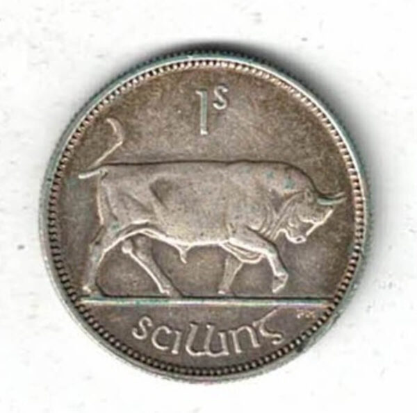1937 Ireland Silver One Shilling Coin. The obverse features a Gaelic harp with date divided.  The reverse features a bull with denomination.