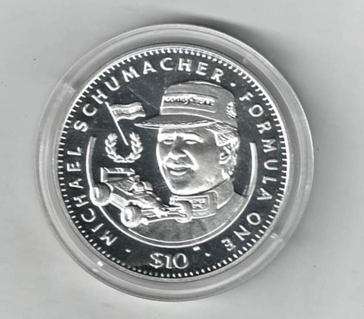 1992 Liberia Silver One Ounce Michael Schumacher Coin This coin does feature a formula 1 car. This coin contains one ounce of 999 fine silver.