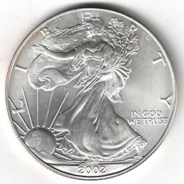 2002 Silver USA One Ounce Eagle. The liberty is on the obverse, The eagle is on the reverse. The coin contains one ounce of 999 fine silver.