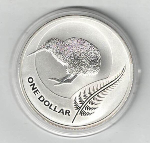 2011 Silver New Zealand One Ounce Kiwi Coin. The coin contains one ounce of 999 fine silver. The Reverse features a kiwi with fern.
