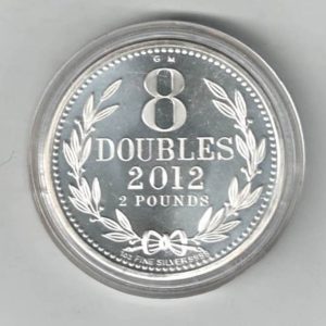 2012 Silver Guernsey One Ounce 8 Doubles. The coat of arms is on the obverse, 8 Doubles is on the reverse. The coin contains one ounce of 9999 fine silver