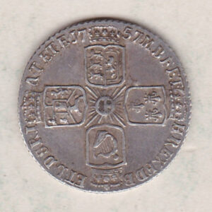 1757 silver sixpence coin featuring a laureate bust of George II. There are four crowned shields arranged in a cross on the Reverse.