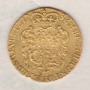 1782 Gold Guinea Coin featuring the fourth laureate head portrait of King George III on the obverse. The crowned quartered shield on the reverse.